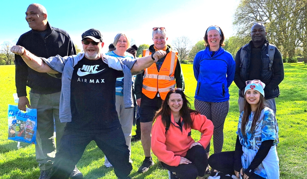 Photo of a group of staff, volunteers and companions at the start of Parkrun in Eastville Park